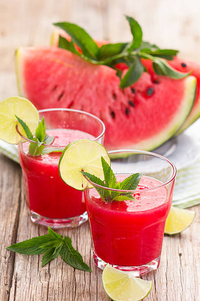 istock Two glasses with watermelon smoothies with lime and mint 476772886