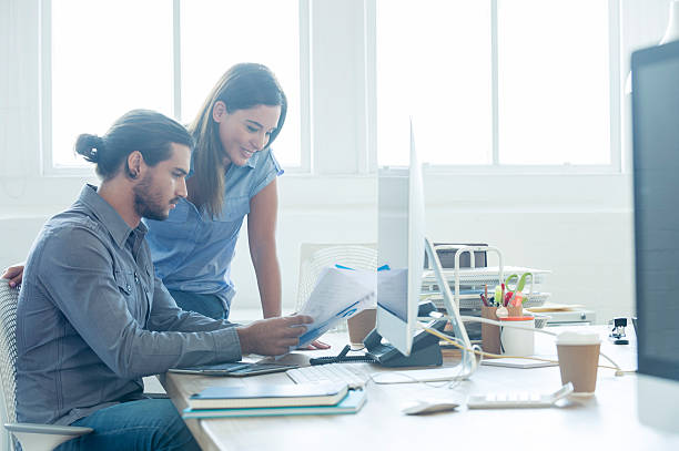istock Business colleagues going over a report together. 476777464