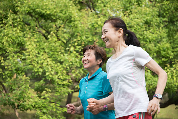 istock Two elderly women running in a park 476781186