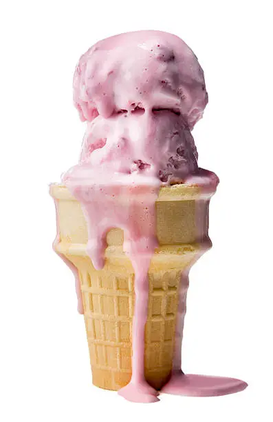 Strawberry ice cream cone melting on a white background with nobody.  Please see my portfolio for other food related images. 
