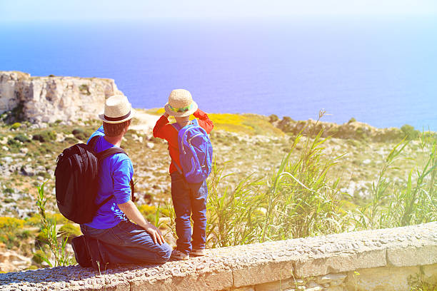 istock father and little son travel in mountains 476781764