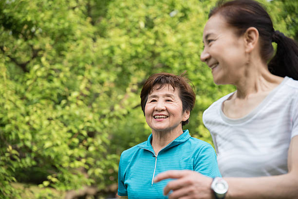 istock Two elderly women running in a park 476787400