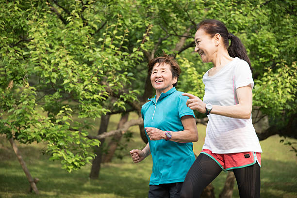 istock Two elderly women running in a park 476787426