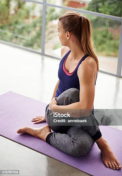 Stretching Her Glutes Stock Photo - Download Image Now - One Woman Only, Pilates, Women