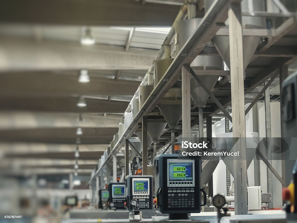 factory production line Heavy machines and digital displays in production line of a factory. Machinery Stock Photo