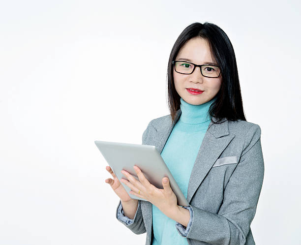 istock Young businesswoman with digital tablet 476789940