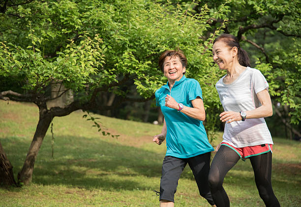 istock Two elderly women running in a park 476790200