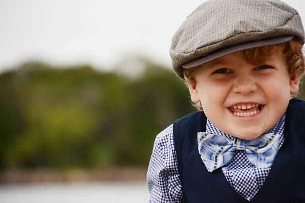 istock Cheeky Vintage Dressed Boy Laughing 476793224