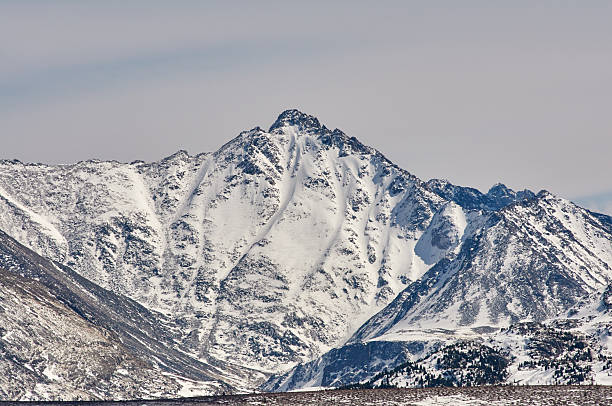 istock Mountains covered with snow and fog 476796134