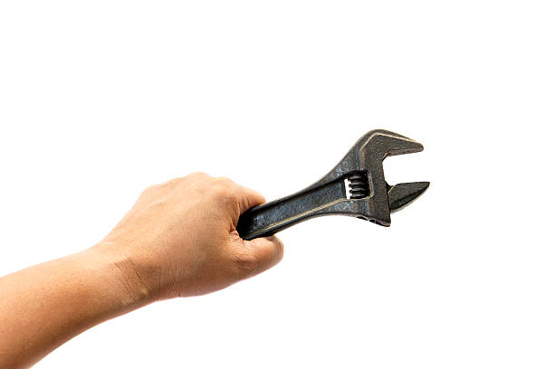 istock Metal wrench tool in hand 476796859