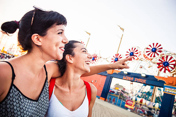 istock Two friends at amusement park 476801186