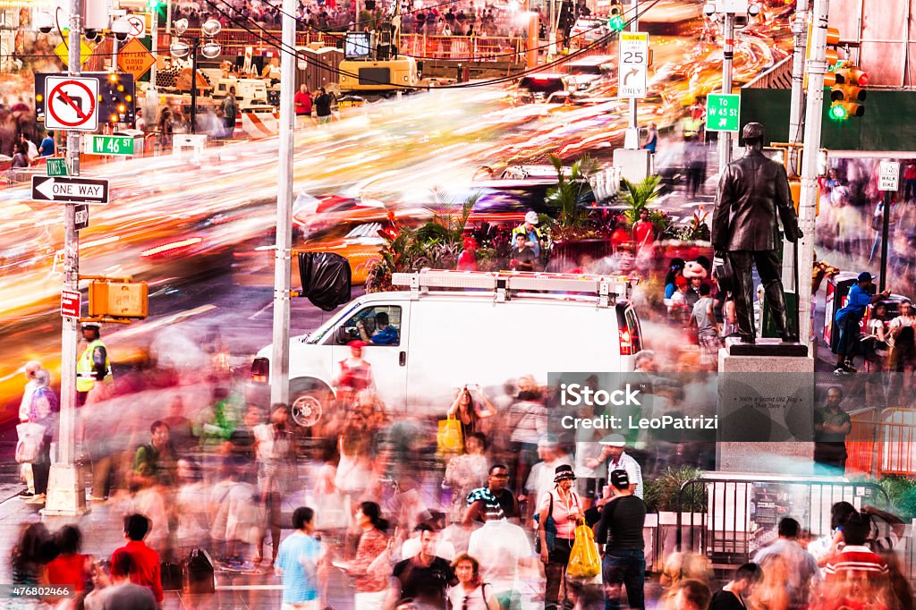 People and traffic in Times Square People crossing in Times Square in the night. City Stock Photo