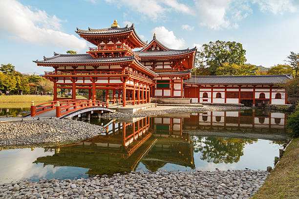 The Phoenix Hall of Byodo-in Temple in Kyoto Kyoto, Japan - October 21 2014: Byodoin temple built in 998 AD during the Heian period, originally a private residence and converted into a temple by a member of the Fujiwara clan in 1052 heian period stock pictures, royalty-free photos & images