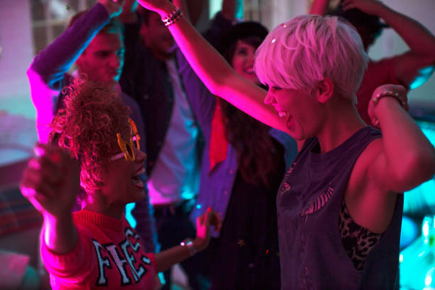 istock Friends dancing together at party 476806017