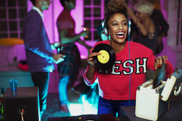istock Woman playing records at party 476806027