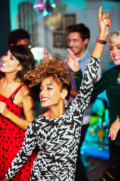 istock Friends dancing together at party 476806083