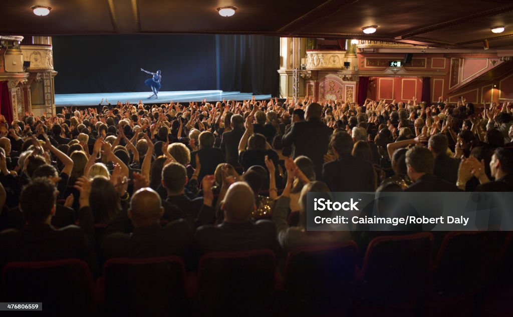 Audience applauding ballerina on stage in theater  Stage Theater Stock Photo