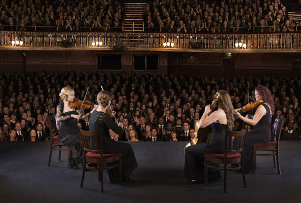 quartet performing on stage in theater - violin women violinist music imagens e fotografias de stock