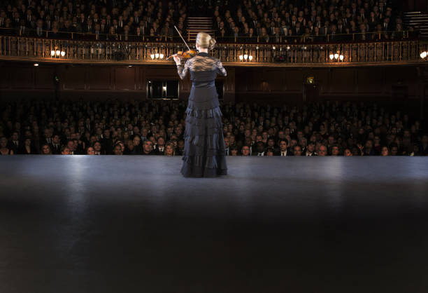 istock Violinist performing on stage in theater 476806665