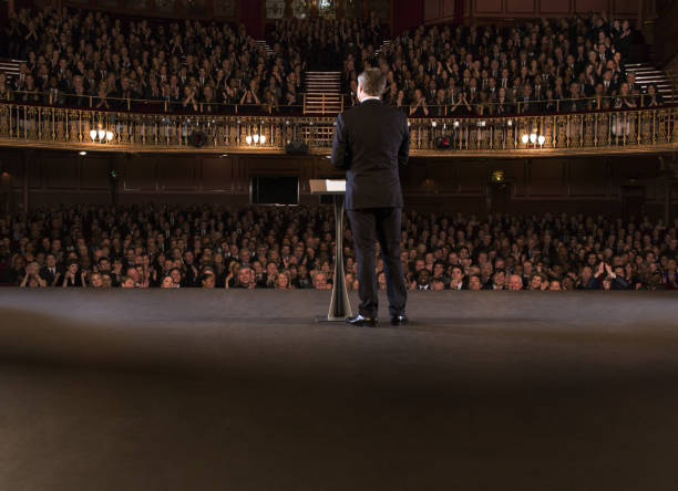 istock Performer on stage in theater 476806693