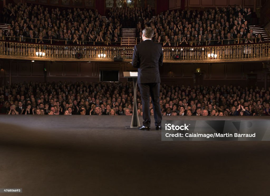 Performer on stage in theater  Public Speaker Stock Photo