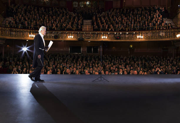 istock Conductor walking onto stage in theater 476806703