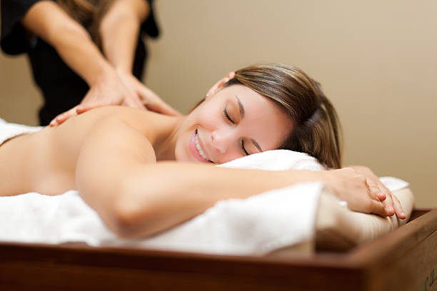 young woman receiving a massage - sweden bildbanksfoton och bilder