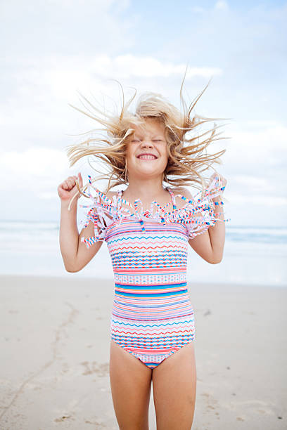 istock Young girl having fun at beach 476808569