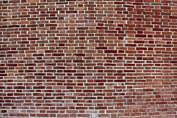 istock background of convex dark red brick wall 476808789