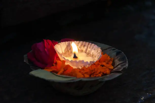 Flowers and candle for Ganga Aarti ritual. Varanasi. Uttar Pradesh, India