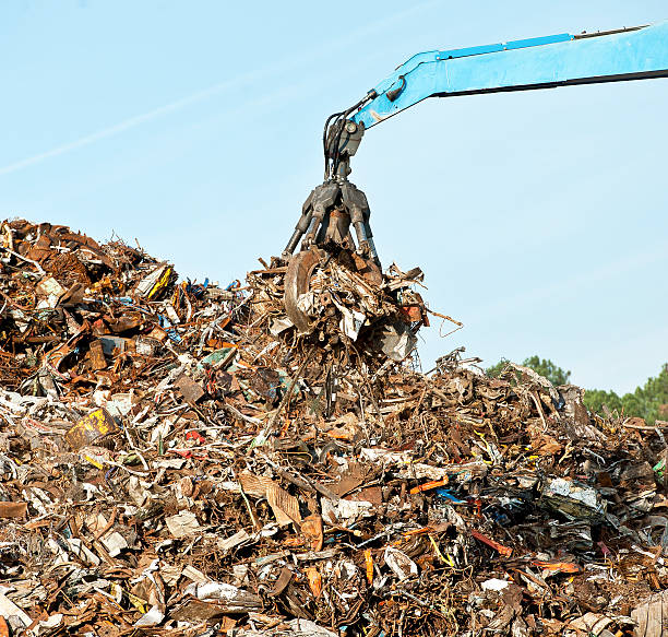 istock Scrap metal recycling plant and crane 476811123