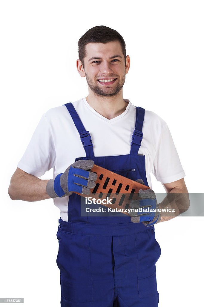 Builder stehend mit roten Ziegeln - Lizenzfrei Lächeln Stock-Foto