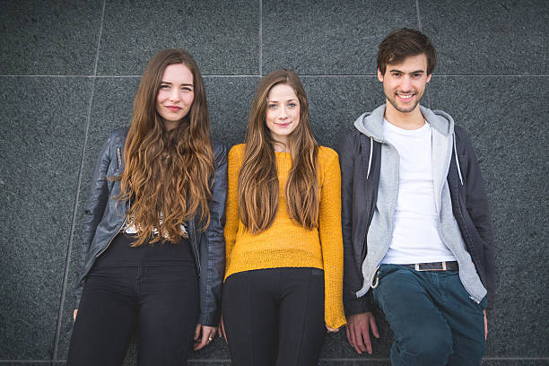 istock Group of friends together, dark wall background 476817450