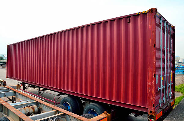 Cargo container on semi trailer chassis Cargo container on semi trailer chassis chassis stock pictures, royalty-free photos & images