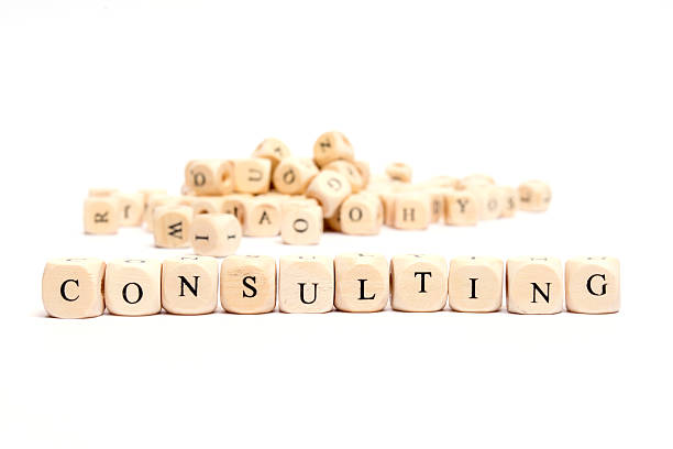 istock word with dice on white background- consulting 476817946