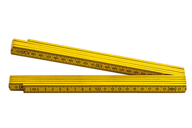 istock Yellow carpenter rule isolated on white background 476818694