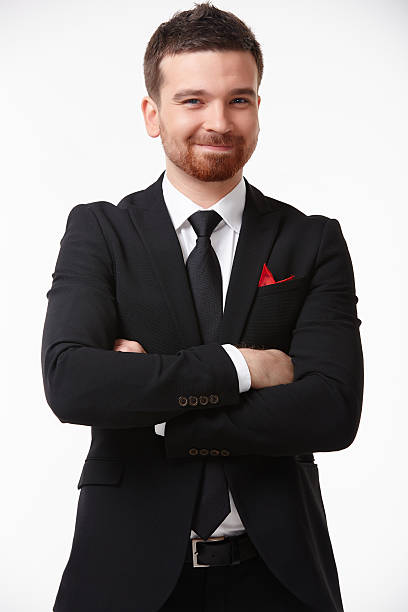 istock businessman in a suit smiling 476819550