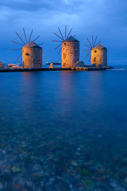istock Ancient windmills of chios at night 476823676