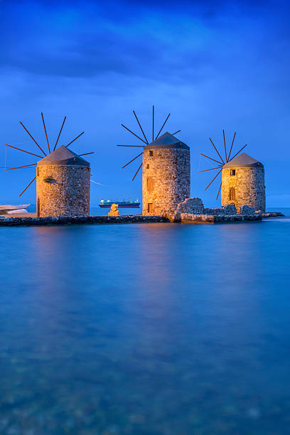 istock Ancient windmills of chios at night 476823984
