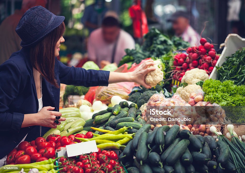 Female At Market Place Young Female Choosing Vegetables At Market Place 2015 Stock Photo