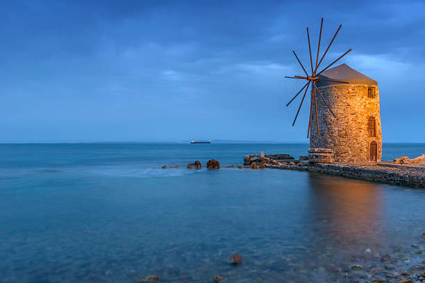 istock Ancient windmills of chios at night 476824242