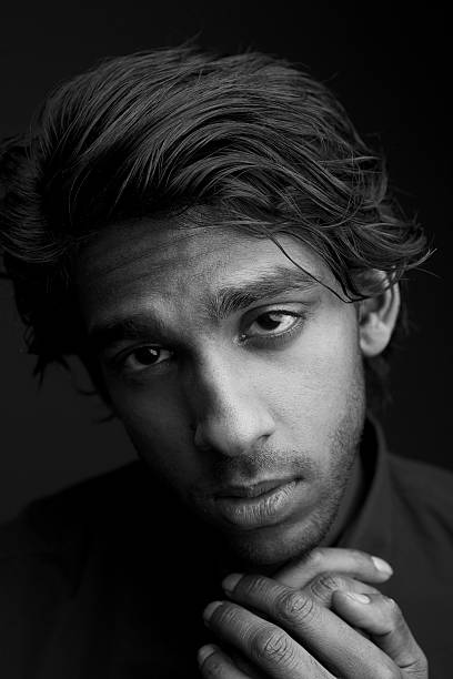 istock Young man with hand to chin 476824257