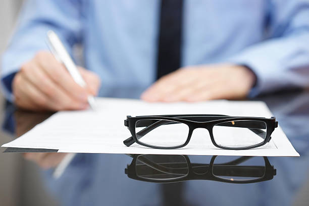 istock Blurred busy entrepreneur in background with focus on glasses 476824280