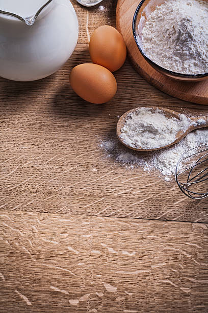 istock flour in spoon and bowl eggs pitcher with milk 476824610