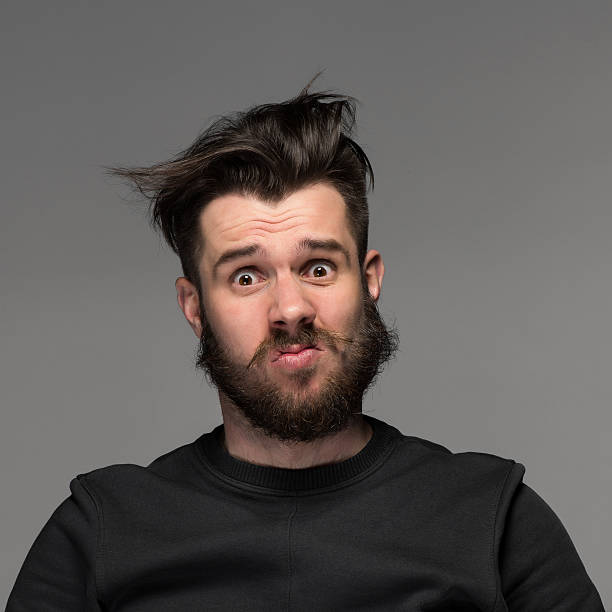 istock Portrait of young tousled man in studio 476825056