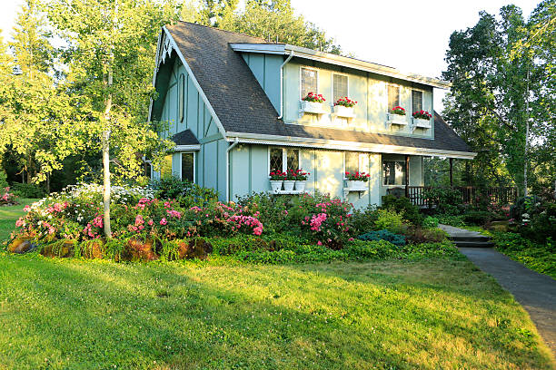 istock Big farmhouse with beautiful flowerbed 476828395
