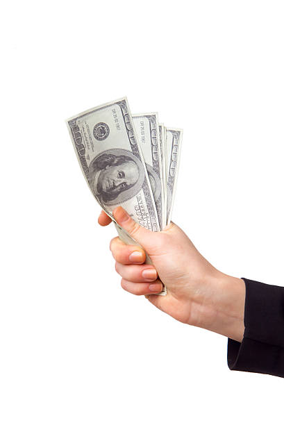 istock Hand with money isolated on a white background 476829976