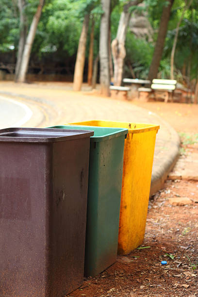istock Yellow, green, brown bins at the park. 476830074