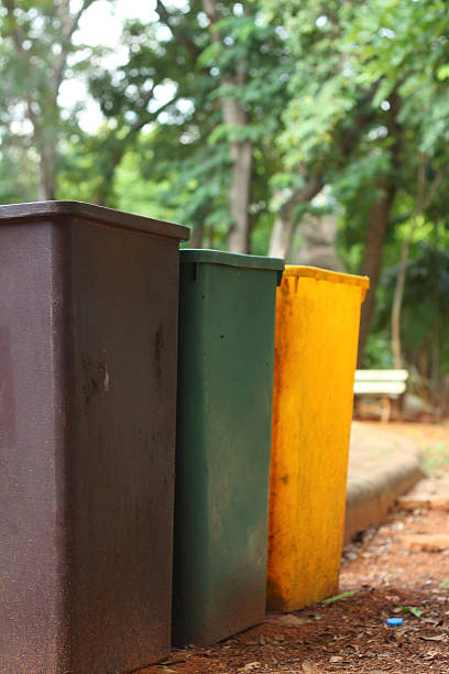 istock Yellow, green, brown bins at the park. 476830076