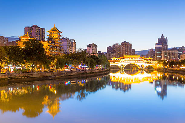 istock Vintage bridge in modern city chengdu at night 476834150